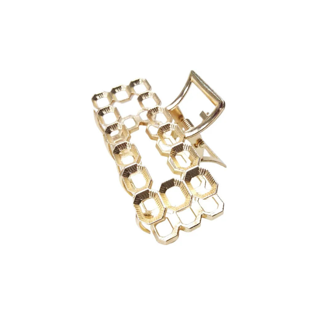 Broche pinza para el cabello dorada